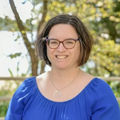 Kayla Orr smiling outside.